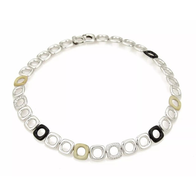 This bold authentic Tiffany & Co. necklace is finely crafted from solid 18k white gold. It features cushion shape design...