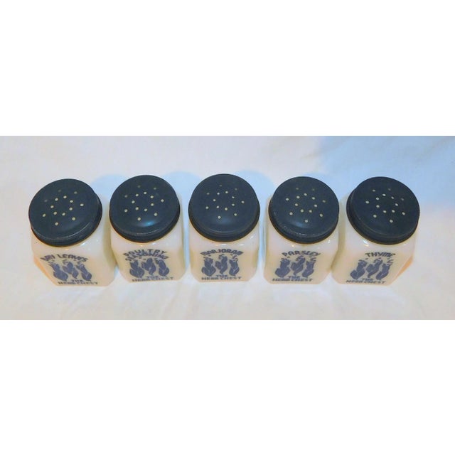 Set of 5 milk glass range shakers called, "The Herb Chest" with patterning in bold blue. Each shaker measures 3" x 1.75"