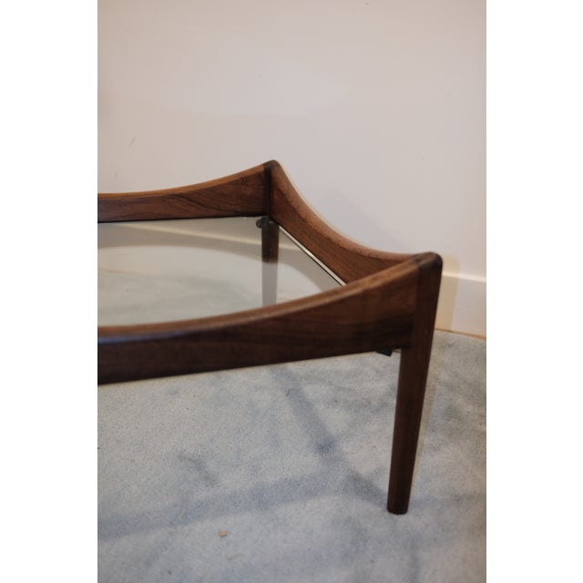 A Danish Modern glass-top side table attributed to Kristian Vedel for Søren Willadsen Møbelfabrik, Denmark, circa 1960s....