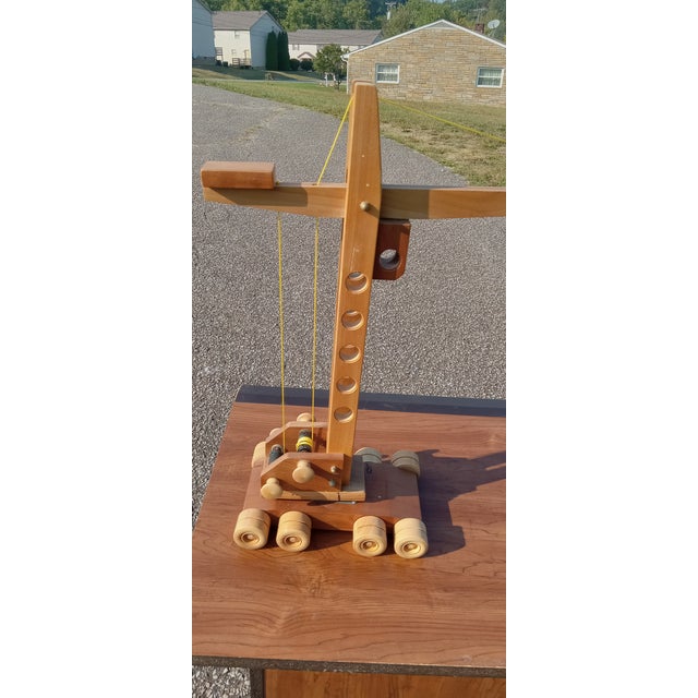Vintage Handmade Wooden Toy Crane Description: This charming handmade vintage wooden toy crane is a delightful piece of...