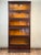 This handsome antique five-stack barrister bookcase dates to circa 1910 and bears its original label for “The Hale System...