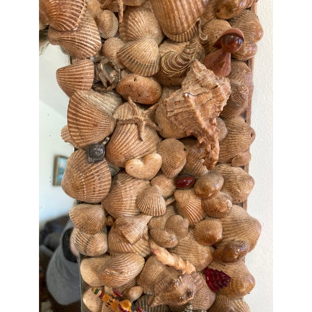 his striking seashell mirror is a true statement piece and a standout among curated vintage finds. The rectangular frame...