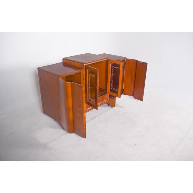 Deco-style sideboard with bar. with a symmetrical composition and elegant curved lines. It has three different modules,...