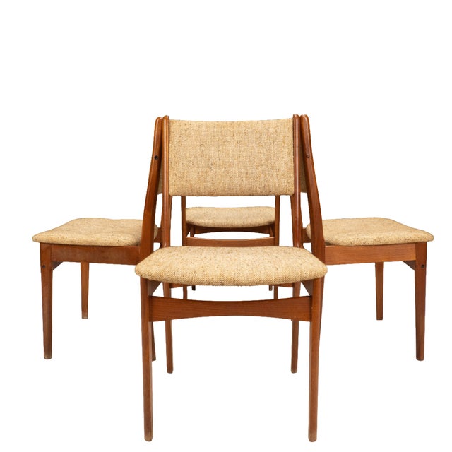 Clean Danish modern set with that classic light, simple profile. Solid teak frames with a warm tone and nicely tapered...