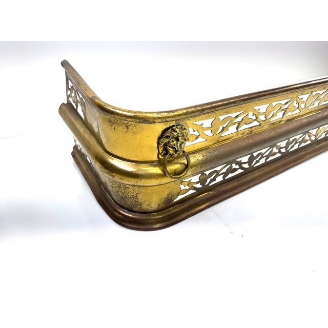 Rustic European 1960s Large Hollywood Regency Brass-Finished Fireplace Fender With Lion Head Ring Pulls For Sale - Image 3 of 11