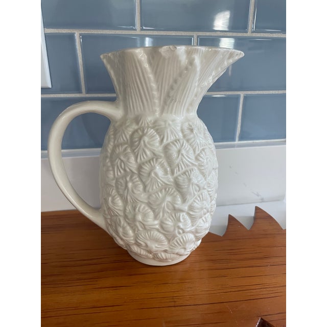 Fun ceramic pitcher in the shape of a pineapple. All white so perfect for that summer table. Designed after earlier...