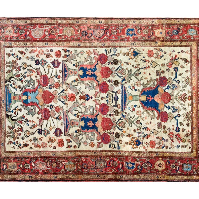 An extraordinary early 20th-century Persian Senneh rug, c. 1900, hand-knotted in fine wool and distinguished by a striking...