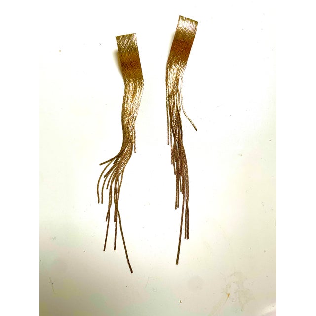 This is part of Chairish’s Fine Jewelry assortment. 6 in long gold fringe shoulder duster earrings from the 1970s