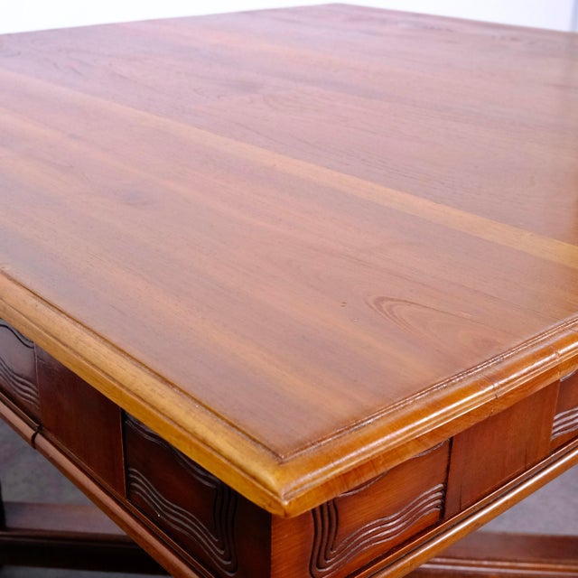 This antique solid wood dining table features a sturdy and elegant design, typical of historical European styles from the...