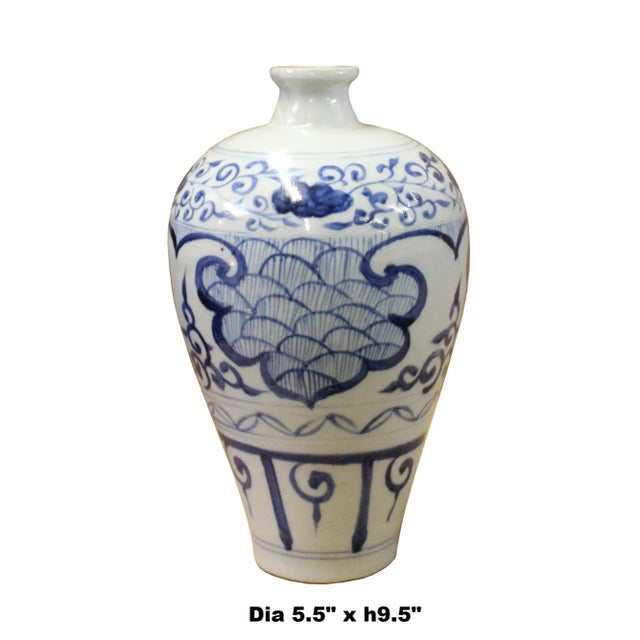 This is a Chinese decorative porcelain vase in Blue and White color finish. The theme is oriental accent graphic....