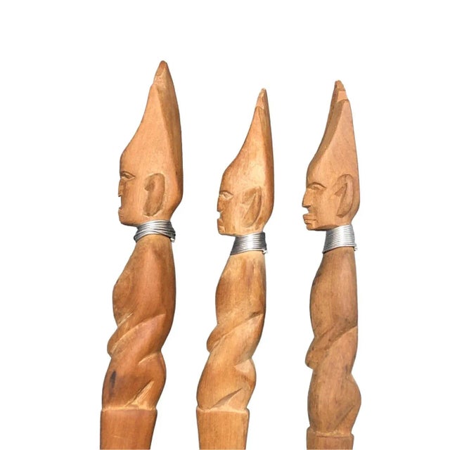 A unique and attractive set of salad serving utensils including spoon, fork, and knife. Solid wood and hand carved in...