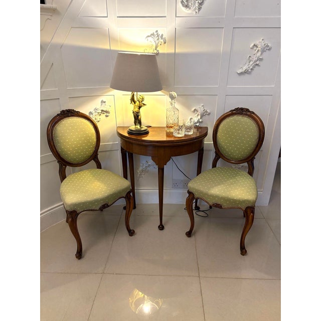 Pair of antique Victorian quality carved walnut side chairs having a quality carved walnut oval padded back, serpentine...