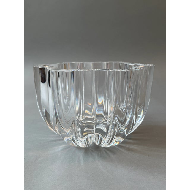 This beautiful, deeply ribbed, five-pointed star crystal bowl was designed by Anna Ehrner who was associated with the firm...