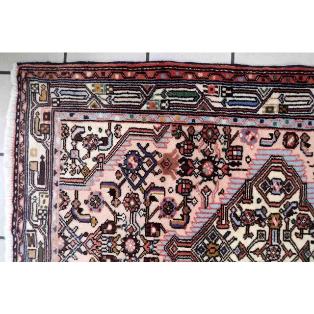 Handmade vintage Persian Malayer rug in pink color. The rug is from the middle of 20th century in original good condition....
