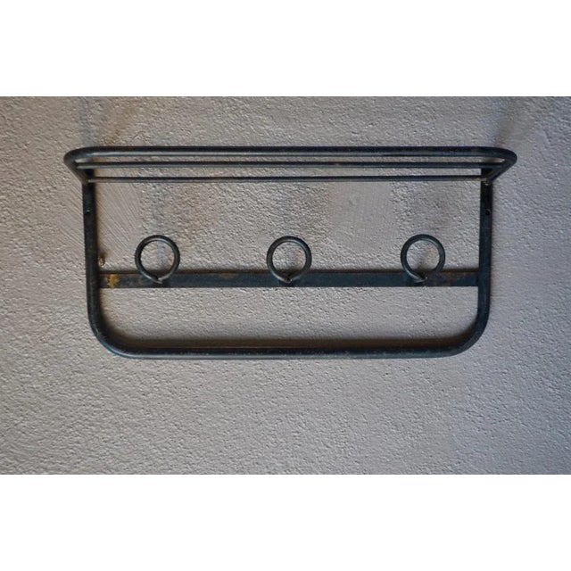 All of black metal, this mural coats holder is a beautiful vintage accessory with gross and industrial pace. Its design is...
