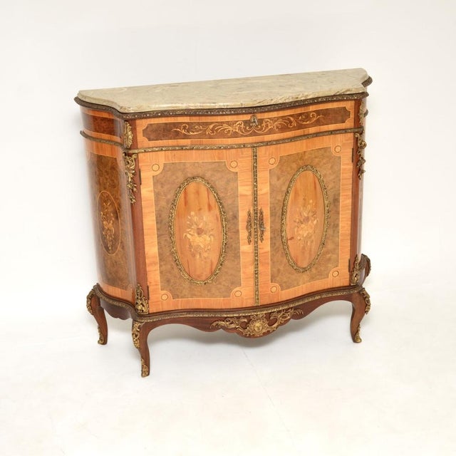 An absolutely gorgeous and extremely impressive antique French marble top cabinet. This was made in France, it dates from...