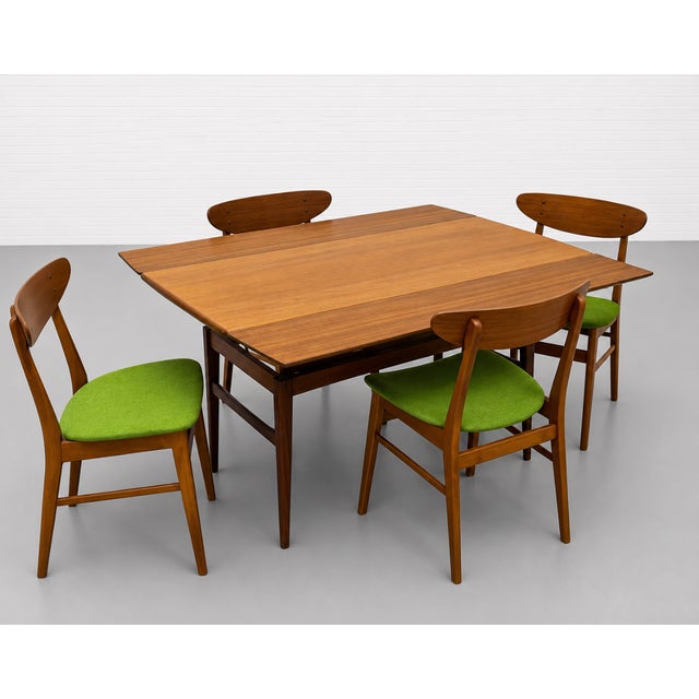 This vintage Mid Century Modern gem easily converts from a coffee table to a desk or console or to a full size dining...