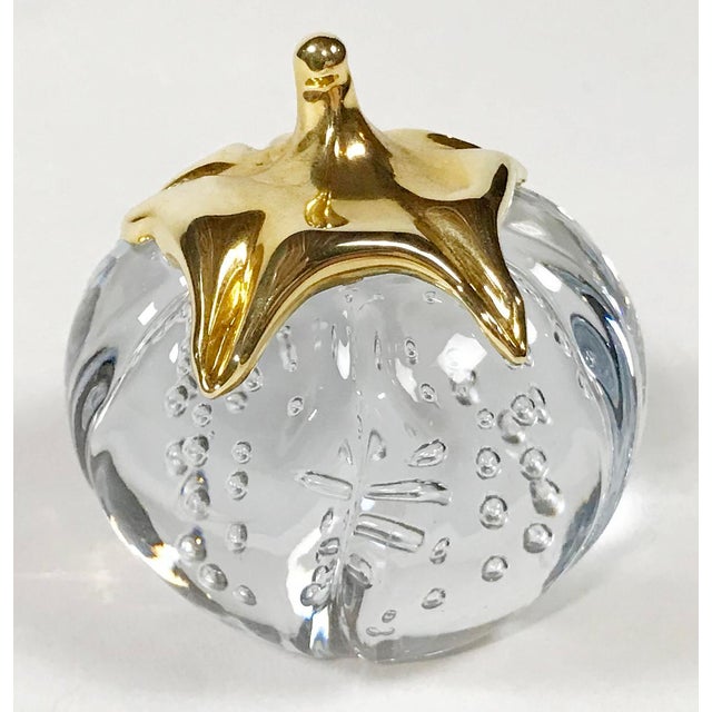Vintage clear crystal glass paper weight in the shape of a pumpkin. Brass stem. Patina to brass. Free of chips or cracks...