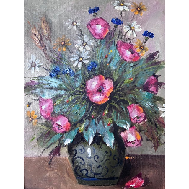 This original vintage oil painting from the 1960s shows a vibrant bouquet of wildflowers arranged in a ceramic vase....