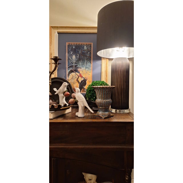 Here is an urn shaped vessel on square plinth with an interesting form and all over glaze. A pleasing blue dominates the...