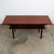 Solid teak Danish modern surfboard coffee table. The solid teak and teak veneer top surface sits upon 4 solid teak tapered...