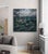 This oil on canvas artwork depicts a striking scene where a unicorn stands majestically atop a rocky outcrop amidst...