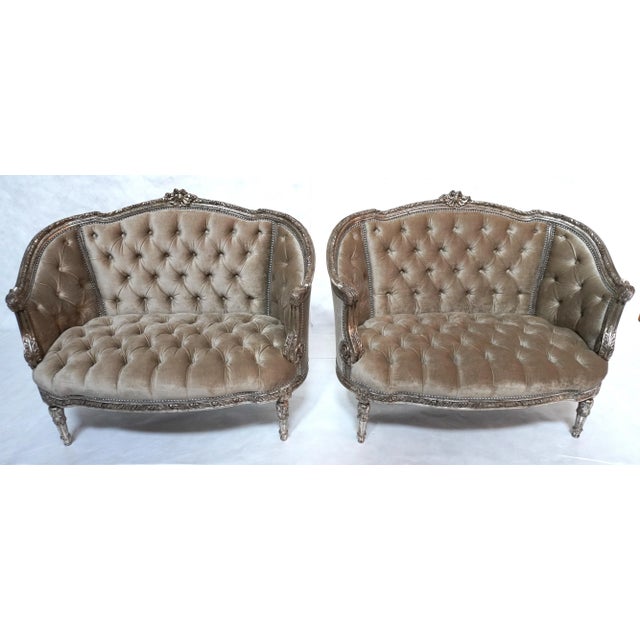 A Pair of 1930s French Carved Silver Gilt Velvet Tufted Settees from MLA Pair of two French carved wood, silver gilt...