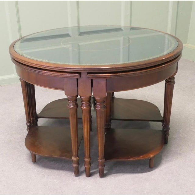 This is a very unusual set of tables, the largest table is circular in shape and the others are quarter wedge shaped and...