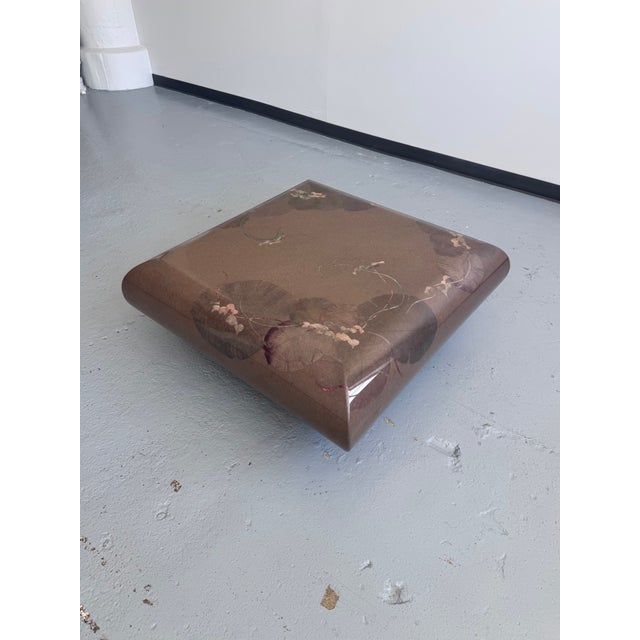 Fabulous vintage postmodern laquered coffee table. Design creates a floating effect, and the mauve lacquered lily pad...