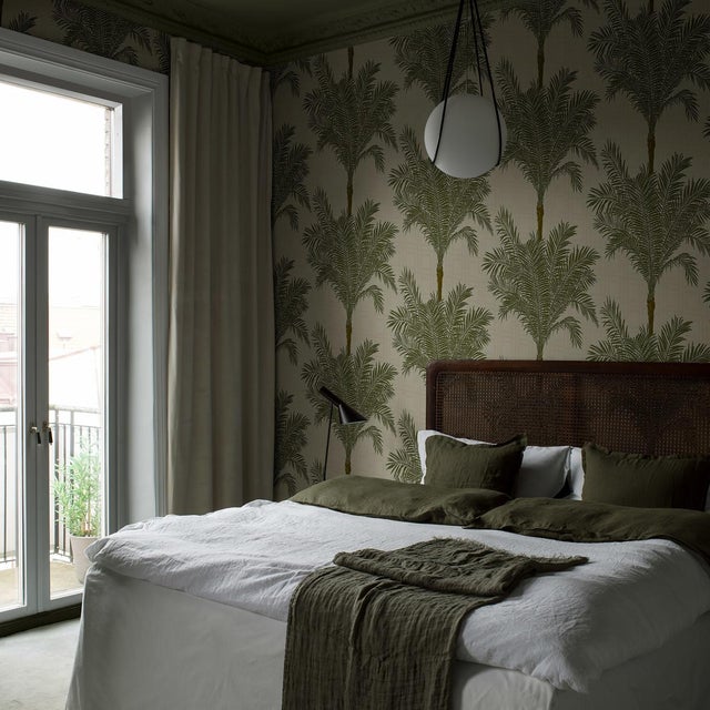 Copacabana features lush palm trees on a graphic bamboo-grid ground to give a scheme a tropical-chic kick. This product is...