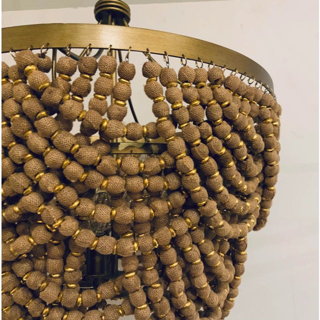 Stylish Currey & Co. Organic Modern Small Burlap Bead Chandelier Prototype, gold finished accents, four lights, showroom...