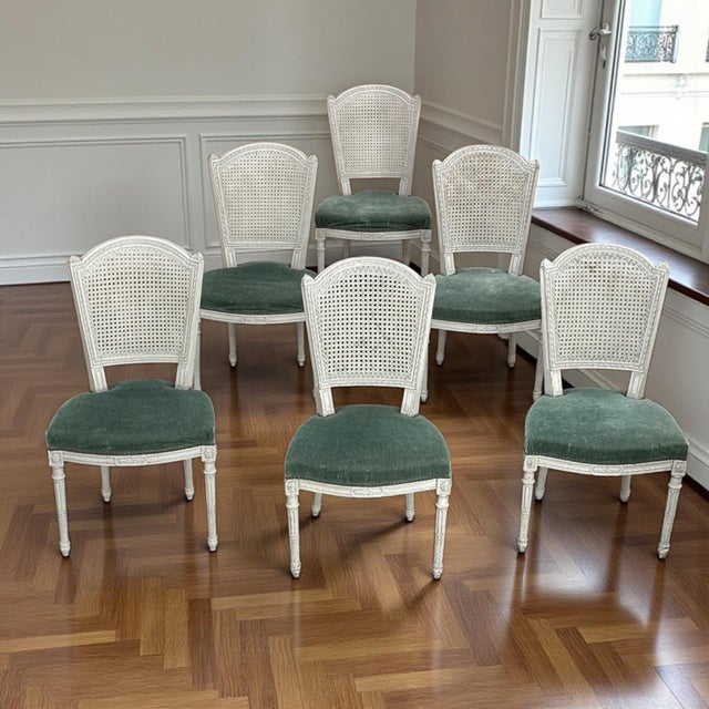 An elegant set of six antique Swedish painted chairs, classical in form and beautiful in their original surface. The white...