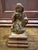 This 18th century polychromed wooden Santos depicts a man kneeling, he is missing both forearms. I am unsure of which...