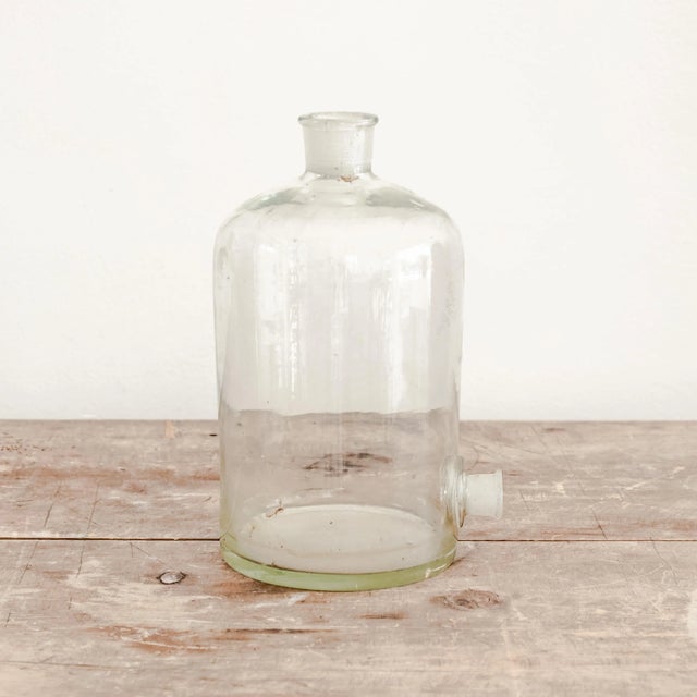 Vintage lab glass narrow neck vessel with flared lip top and dispenser spout.