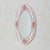 An Italian hand-painted ceramic wall mirror by Bassano, dating to the mid-20th century. The oval frame is sculpted in...