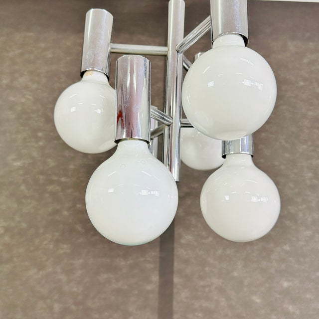 Dimensions: H 31” x W 13.5” Vintage Italian chromed metal Space Age Sputnic chandelier from the 1960s. Please see our...