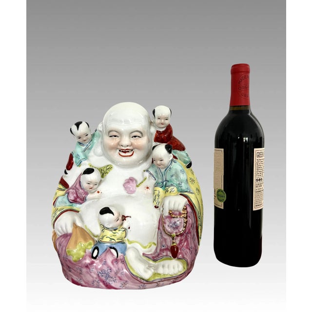 Vintage 1950/60's Laughing Buddha porcelain statue that is traditionally hand painted with colourful enamels and glazed...