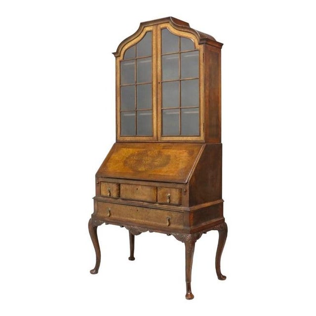 This exquisite antique secretary desk, crafted circa 1900, showcases a sophisticated combination of burl walnut and carved...