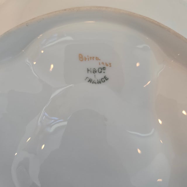 An authentic mid-century French porcelain oyster plate manufactured by Haviland & Co. in Limoges, France. This striking...