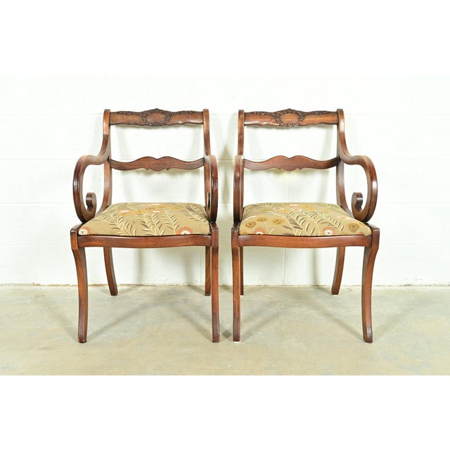 A gorgeous pair of Regency style armchairs or dining captain chairs In the manner of Kindel Furniture Manufactured by The...