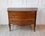 A beautiful antique Louis XV style commode crafted from solid walnut, featuring the graceful curves and refined...