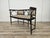 Early 20th-century bentwood sofa with padded seat and backrest decorated with brass studs. The sofa is attributed to...