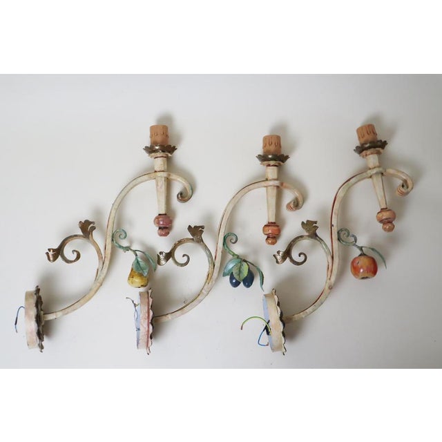 This set of three enormous, hand-forged wall lights is exceptional, embodying elegance and quality. Hand-forged by a...