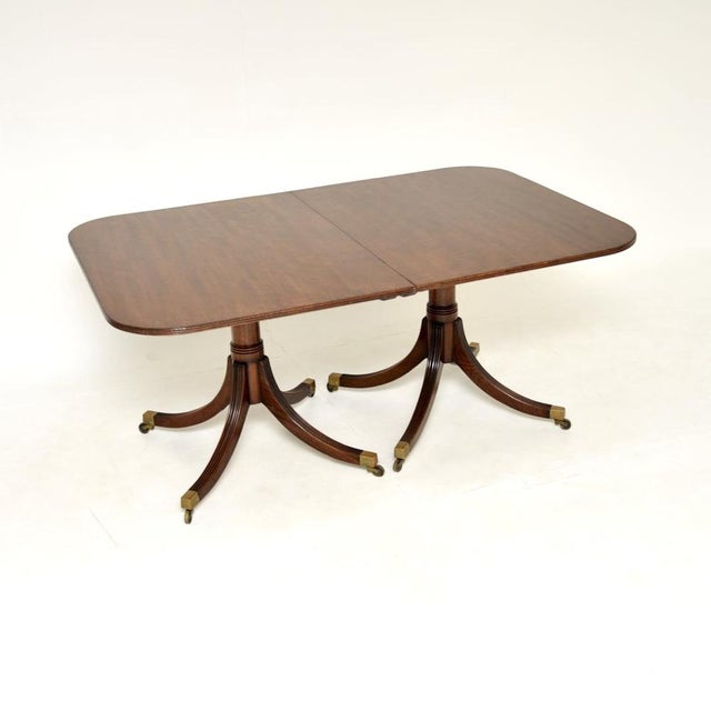 A lovely antique Regency style extending dining table. This was made in England, it dates from around the 1900-1920...