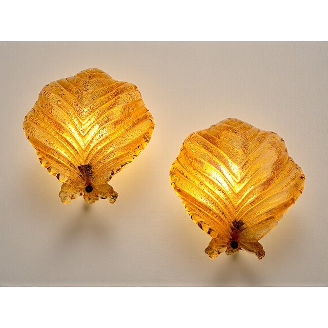 A pair of wall lamps (sconces) crafted entirely by hand by master glassmakers in murano. These pieces represent the...