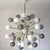 Italian sputnik chandelier with 40 Murano glass globes in glossy gray and glossy white color, mounted on brass frame in...