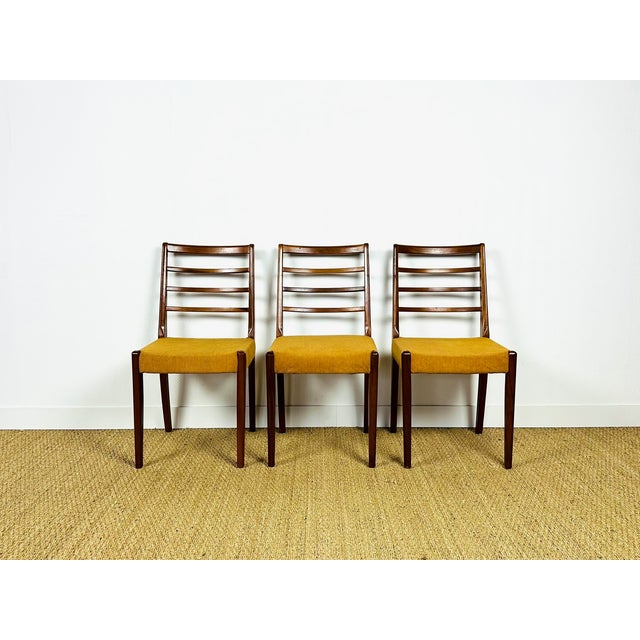 An elegant set of vintage chairs in a Scandinavian design, combining simplicity and refinement. The frames are made of...