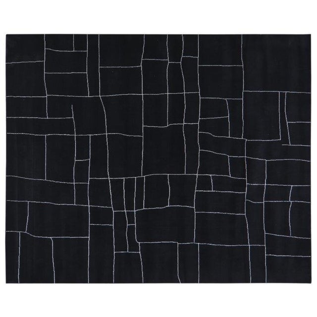 Hand-knotted with care using traditional rug-making techniques, this wool rug blends timeless craftsmanship with a modern...