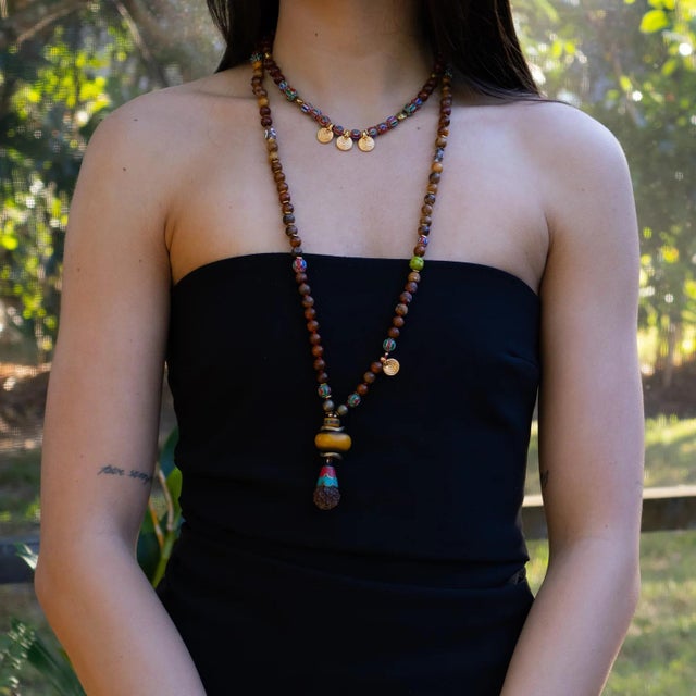 Add a touch of vibrant elegance to your look with our Ethnic Boho Gold Spiral Charm Beaded Choker Necklace, a handmade...