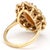 The centerpiece of this 14K yellow gold, mid-century modern ring is a large, marquise-shaped, coral stone showcased by a...